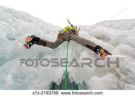 Elijah Weber ice climbing a route called Genesis 1 which is rated WI-4 and located in Hyalite Canyon in the Gallatin Mountains near the city of Bozeman in southern Montana. View Large Photo Image Stock Photo - Elijah Weber ice climbing a route called Genesis 1 which is rated WI-4 and located in Hyalite Canyon in the Gallatin Mountains near the city of Bozeman in southern Montana.. Fotosearch
