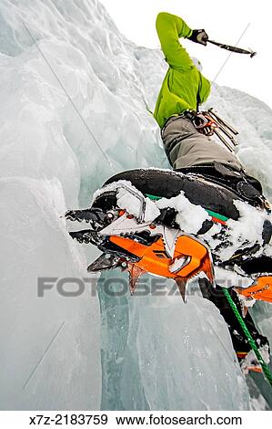Elijah Weber ice climbing a route called Genesis 1 which is rated WI-4 and located in Hyalite Canyon in the Gallatin Mountains near the city of Bozeman in southern Montana. View Large Photo Image Stock Photo - Elijah Weber ice climbing a route called Genesis 1 which is rated WI-4 and located in Hyalite Canyon in the Gallatin Mountains near the city of Bozeman in southern Montana.. Fotosearch