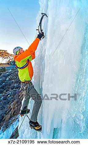 Stock Photography - Elijah Weber ice climbing Lower Falls Right which is rated WI-4 and located at Shoshone Falls in the Snake River Canyon near the city of Twin Falls in southern Idaho.. Fotosearch