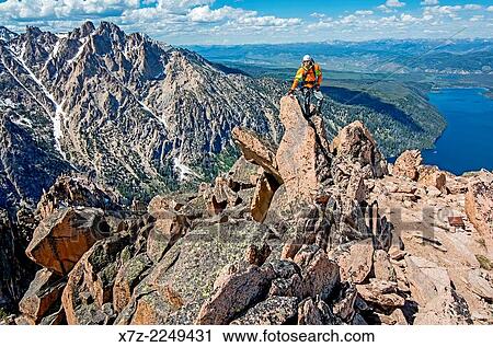Elijah Weber on the summit after climbing the Chockstone Couloir, AKA the Boy Scout Couloir an alpine route which is rated Grade 3, Class 4 and located on The Grand Mogul in the Sawtooth Mountains in central Idaho. View Large Photo Image Stock Image - Elijah Weber on the summit after climbing the Chockstone Couloir, AKA the Boy Scout Couloir an alpine route which is rated Grade 3, Class 4 and located on The Grand Mogul in the Sawtooth Mountains in central Idaho.. Fotosearch
