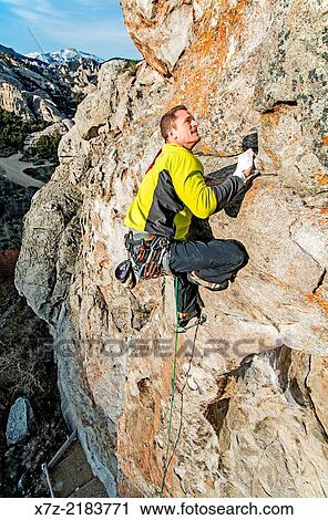 Elijah Weber rock climbing a route called Colossus which is rated 5, 10 and located on Bath Rock at the City Of Rocks National Reserve near the town of Almo in southern Idaho. View Large Photo Image Stock Image - Elijah Weber rock climbing a route called Colossus which is rated 5, 10 and located on Bath Rock at the City Of Rocks National Reserve near the town of Almo in southern Idaho.. Fotosearch