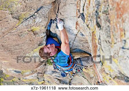 Elijah Weber rock climbing a route called Yellow Wall which is rated 5, 9 and located on Yellow Wall at The City Of Rocks National Reserve near the town of Almo in southern Idaho. View Large Photo Image Stock Photo - Elijah Weber rock climbing a route called Yellow Wall which is rated 5, 9 and located on Yellow Wall at The City Of Rocks National Reserve near the town of Almo in southern Idaho.. Fotosearch