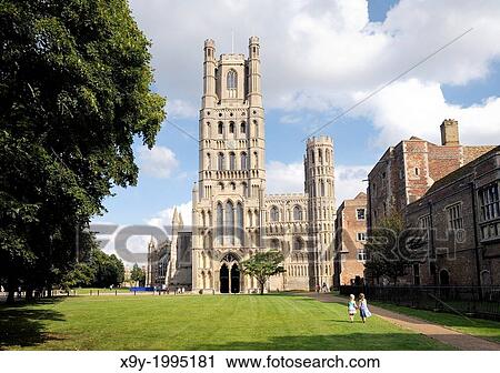 Stock Image - Ely Cathedral, Cambridgeshire, England. Over Palace Green to the West Tower and the West Door.. Fotosearch