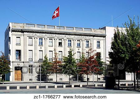 Stock Photo - Embassy of Switzerland in Berlin with the Swiss national flag - Caution: For the editorial use only Not for advertising or other commercial use!. Fotosearch