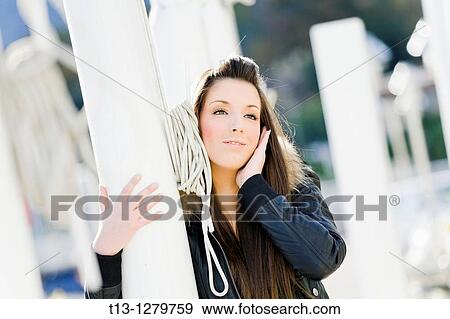 Embracing a mast young woman is happy View Large Photo Image Stock Photo - Embracing a mast young woman is happy. Fotosearch