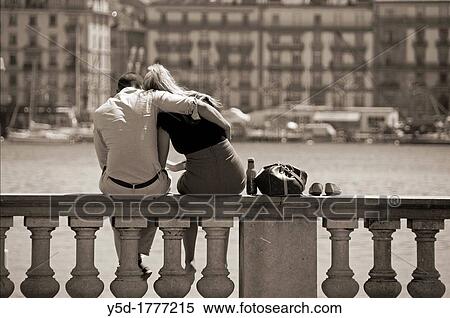Embracing couple siting in front of Geneva Lake, Geneva, Switzerland View Large Photo Image Stock Photography - Embracing couple siting in front of Geneva Lake, Geneva, Switzerland. Fotosearch
