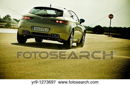 Emergency braking before entering the wrong way lane. Car: Alfa Romeo Brera View Large Photo Image Stock Photo - Emergency braking before entering the wrong way lane. Car: Alfa Romeo Brera. Fotosearch