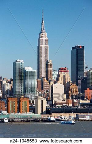 Empire State Building, Midtown Manhattan skyline across Hudson River from New Jersey, New York City, USA View Large Photo Image Stock Image - Empire State Building, Midtown Manhattan skyline across Hudson River from New Jersey, New York City, USA. Fotosearch