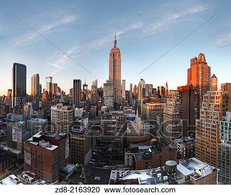 Stock Image - empire state from 230 fifth rooftop. nyc.. Fotosearch