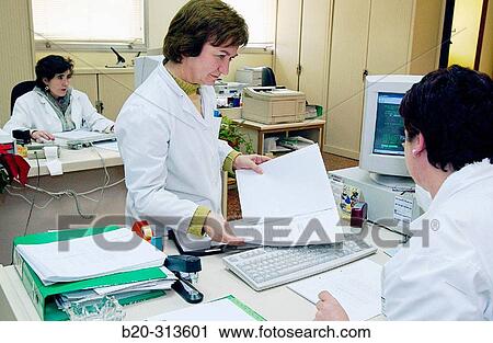 Employees working at administration offices of hospital View Large Photo Image Stock Image - Employees working at administration offices of hospital. Fotosearch