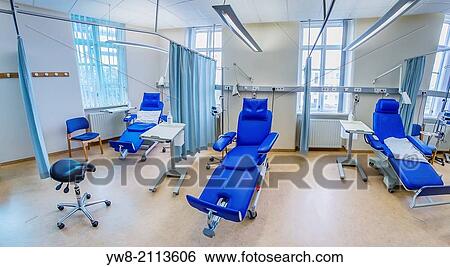 Stock Photograph - Empty chairs in a Hospital room used for chemotherapy treatments. Landspitalinn Hospital in Reykjavik, Iceland.. Fotosearch