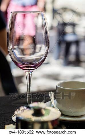 Stock Image - Empty Cup of wine on terrace bar of Laguardia village, La Rioja, Spain. Fotosearch