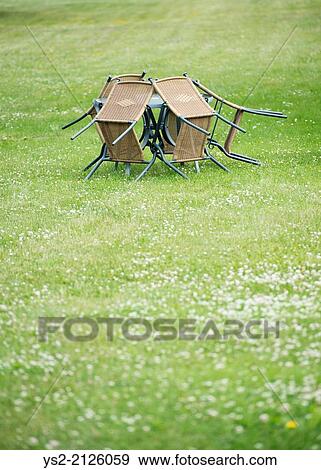 Empty garden patio with vacant chairs and table on big lawn with copy space. View Large Photo Image Stock Photo - Empty garden patio with vacant chairs and table on big lawn with copy space.. Fotosearch