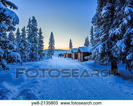 Stock Image - Empty road close to the IceHotel, Jukkasjarvi, Lapland Sweden.. Fotosearch