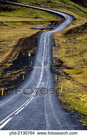 Picture - empty road from Hafnarfjordur do Nesjavellir - Geothermal station, inland of Iceland, Iceland.. Fotosearch