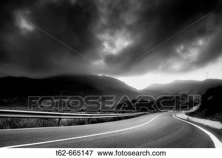 Empty road under storm clouds. El Priorat, Tarragona province, Catalonia, Spain View Large Photo Image Stock Photo - Empty road under storm clouds. El Priorat, Tarragona province, Catalonia, Spain. Fotosearch