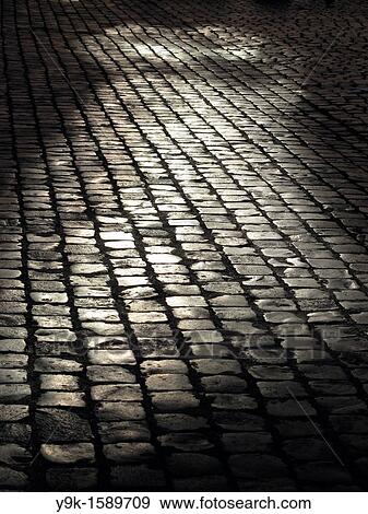 Stock Photo - Empty street with cobbles in Rome, Italy. Fotosearch