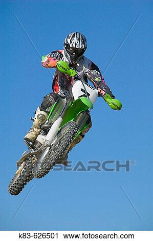 Enduro motorcyclist jumping. View Large Photo Image Stock Image - Enduro motorcyclist jumping.. Fotosearch