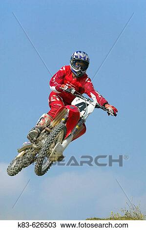 Enduro motorcyclist jumping. View Large Photo Image Stock Image - Enduro motorcyclist jumping.. Fotosearch