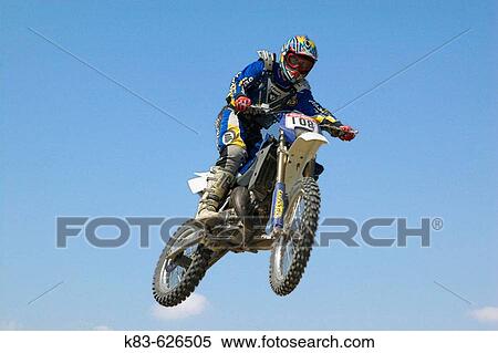 Enduro motorcyclist jumping. View Large Photo Image Stock Photography - Enduro motorcyclist jumping.. Fotosearch