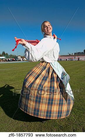Energy of teenager girl spinning dance traditional dress portrait in costume with scarf at festival village near Vilnius Lithuania Lithuanian smile joyful joy View Large Photo Image Stock Image - Energy of teenager girl spinning dance traditional dress portrait in costume with scarf at festival village near Vilnius Lithuania Lithuanian smile joyful joy. Fotosearch