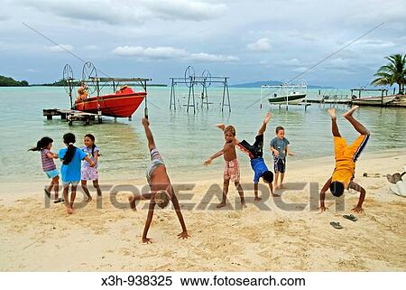enfants jouant sur la plage, Bora-Bora, iles de la Societe, archipel de la Polynesie francaise, ocean pacifique sud View Large Photo Image Stock Photography - enfants jouant sur la plage, Bora-Bora, iles de la Societe, archipel de la Polynesie francaise, ocean pacifique sud. Fotosearch
