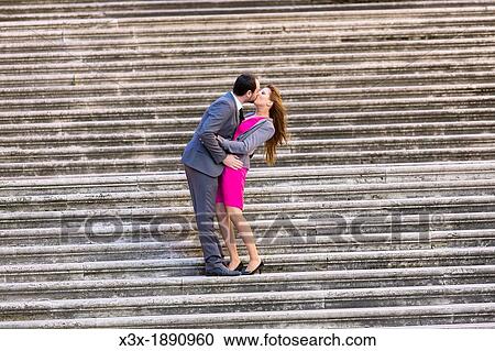Engagement couple kissing on stairs in Rome Italy View Large Photo Image Stock Image - Engagement couple kissing on stairs in Rome Italy. Fotosearch