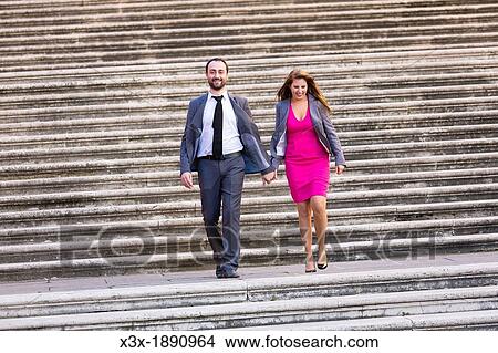 Engagement couple walking on stairs in Rome Italy View Large Photo Image Picture - Engagement couple walking on stairs in Rome Italy. Fotosearch