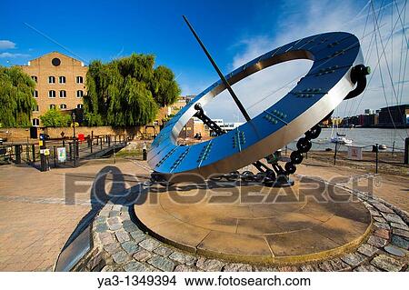 England, Greater London, London Borough of Tower Hamlets Sun dial near the entrance to the St Katharine Docks, on the north bank of the River Thames near the London Tower Bridge View Large Photo Image Picture - England, Greater London, London Borough of Tower Hamlets Sun dial near the entrance to the St Katharine Docks, on the north bank of the River Thames near the London Tower Bridge. Fotosearch