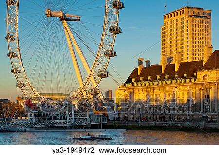 Stock Image - England, Greater London, London Borough of Lambeth. The London Eye (also known as the Millennium Wheel), the tallest Ferris wheel in Europe located on the south bank of the River Thames.. Fotosearch