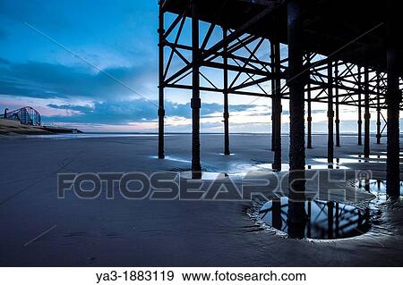 England, Lancashire, Blackpool Underneath the Blackpool South Pier, looking towards the Blackpool Pleasure Beach View Large Photo Image Stock Photo - England, Lancashire, Blackpool Underneath the Blackpool South Pier, looking towards the Blackpool Pleasure Beach. Fotosearch