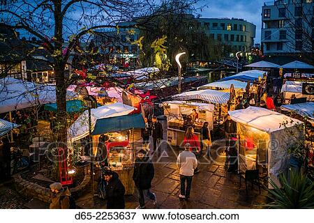 Stock Photo - England, London, Camden, Camden Market, outdoor food court, dusk.. Fotosearch