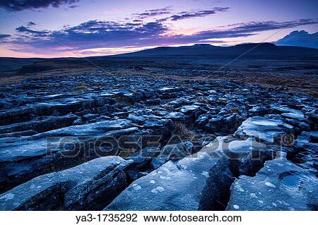 England, North Yorkshire, Yorkshire Dales National Park Limestone pavement known as Moughton Scars, near the small village of Horton in Ribblesdale, with the peaks of Ingleborough in the distance View Large Photo Image Stock Image - England, North Yorkshire, Yorkshire Dales National Park Limestone pavement known as Moughton Scars, near the small village of Horton in Ribblesdale, with the peaks of Ingleborough in the distance. Fotosearch