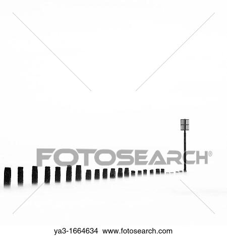 England, Northumberland, Blyth Abstract shot of wooden groyne reaching out from the beach to the North Sea View Large Photo Image Picture - England, Northumberland, Blyth Abstract shot of wooden groyne reaching out from the beach to the North Sea. Fotosearch