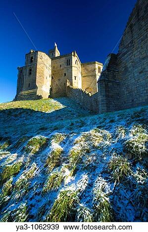 England, Northumberland, Warkworth Castle Warkworth Castle English Heritage, a magnificent 12th century stone motte and bailey fortress, located near the Northumberland Heritage Coast View Large Photo Image Stock Photo - England, Northumberland, Warkworth Castle Warkworth Castle English Heritage, a magnificent 12th century stone motte and bailey fortress, located near the Northumberland Heritage Coast. Fotosearch