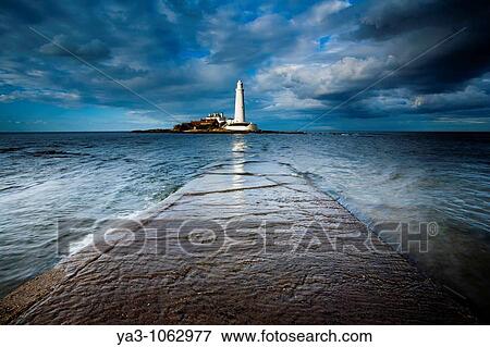 Stock Photo - England, Tyne and Wear, Whitley Bay Incoming tide engulfs the causeway linking St Mary's Island & lifehouse to the mainland. Fotosearch