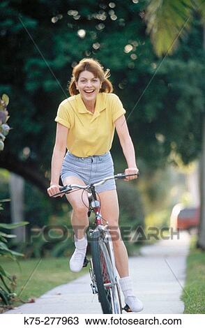 Stock Image - Enjoying a bike ride. Fotosearch