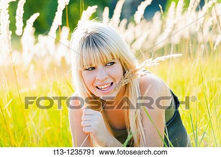 Enjoying early sunset in high grass View Large Photo Image Stock Image - Enjoying early sunset in high grass. Fotosearch