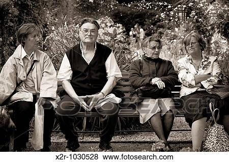 Stock Photo - ? Enjoying the Gardens? - photographed in Monets? Garden in Giverny In Normandy, France. Fotosearch