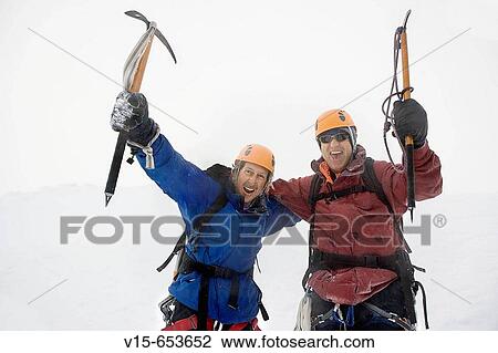 Enthusiastic mountaineers in Snowy Mountain with ice axes View Large Photo Image Stock Image - Enthusiastic mountaineers in Snowy Mountain with ice axes. Fotosearch