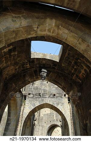 Entrance alley to the fortified city of Carcassonne through the Narbonne Gate. Carcassonne, Languedoc - Rousillon, France, Europe. View Large Photo Image Picture - Entrance alley to the fortified city of Carcassonne through the Narbonne Gate. Carcassonne, Languedoc - Rousillon, France, Europe.. Fotosearch