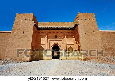 Stock Photo - Entrance and fortifications of the Alaouite Ksar Fida built by Moulay Isma? l the second ruler of the Moroccan Alaouite dynasty ( reigned 1672-1727 ). Residence of the Khalifa or Caid of Tafilalet until 1965. Tafilalet Oasis, near Rissini, Morocco.. Fotosearch