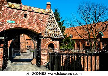 Stock Photo - entrance of the medieval fortress in Malbork, Poland. Fotosearch