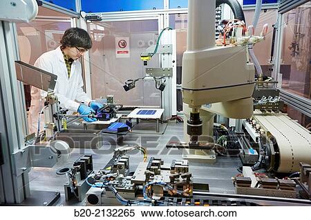 Stock Photography - Equipment manufacturing photovoltaic cell strings. For joining and welding solar cells. Making strings. Robotic manufacture. Energy and Environment Division. Tecnalia Research and Innovation. Donostia. San Sebastian. Gipuzkoa. Basque Country. Spaip Europe. Fotosearch