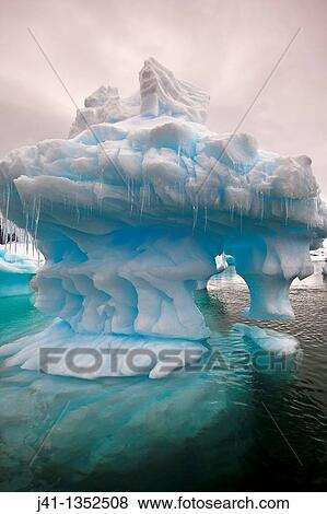 Eroded iceberg with icicles, Pleneau Island, Antarctic Peninsula. View Large Photo Image Stock Photo - Eroded iceberg with icicles, Pleneau Island, Antarctic Peninsula.. Fotosearch