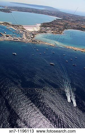 Stock Image - Es Savina harbor, Des Peix lagoon on the right, Pudent lagoon on top, Formentera, Balearic Islands, Spain. Fotosearch