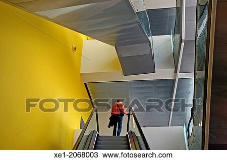 Stock Image - Escalator, Disseny Hub Barcelona building, Design Museum, 2013, arch. Martorell, Bohigas and Mackay, Barcelona, Catalonia, Spain. Fotosearch