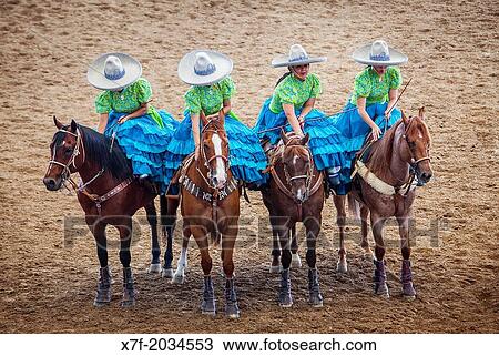 Escaramuzas ride their horses. A charreada Mexican rodeo at the Lienzo Charro Zermeno, Guadalajara, Jalisco, Mexico. View Large Photo Image Stock Image - Escaramuzas ride their horses. A charreada Mexican rodeo at the Lienzo Charro Zermeno, Guadalajara, Jalisco, Mexico.. Fotosearch