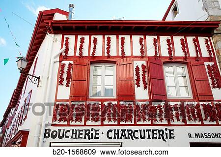 Espelette Peppers, Chili peppers left to dry at the walls of the houses, Espelette, Aquitaine, Basque Country, Pyrenees Atlantiques, 64, France. View Large Photo Image Stock Photo - Espelette Peppers, Chili peppers left to dry at the walls of the houses, Espelette, Aquitaine, Basque Country, Pyrenees Atlantiques, 64, France.. Fotosearch