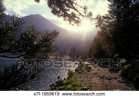 Stock Photo - `Estany Llong?,Llong lake, Aig? estortes i Estany de Sant Maurici National Park, Pyrenees, Lleida province, Catalonia, Spain. Fotosearch